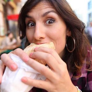 AUTOIMMUNE ISSUES: WOMAN EATING A SANDWICH