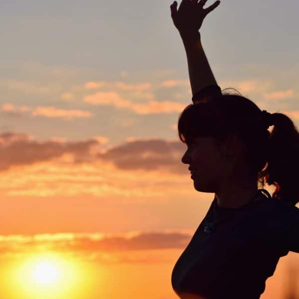 WOMAN OUTISIDE GETING VITAMIN D FROM THE SUN