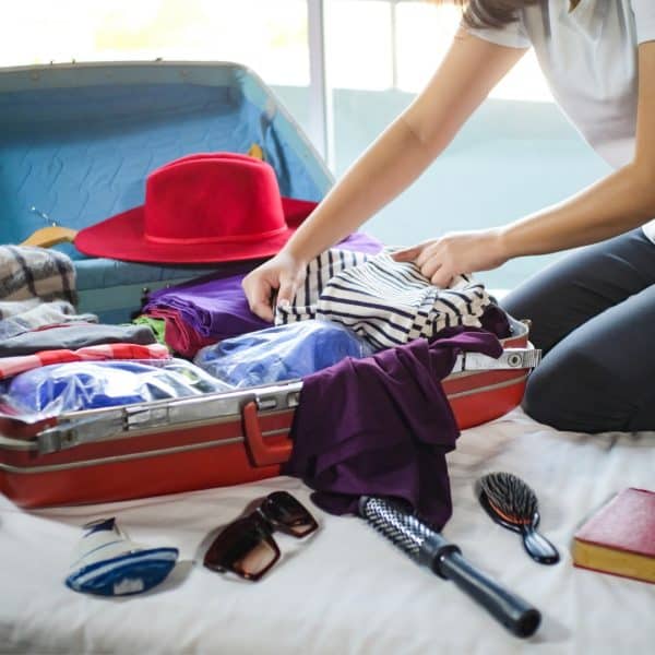 WOMAN WITH AUTOIMMUNE ISSUES PACKING A BAG FOR A TRIP